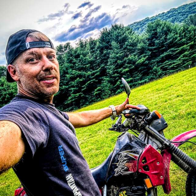Daniel Bennett riding in the mountains